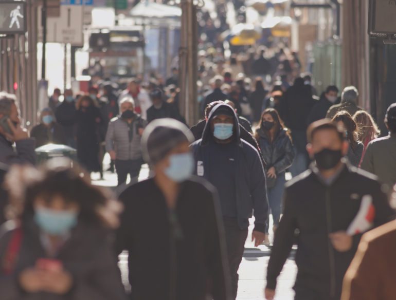 Crowd of walking masked people urban setting 