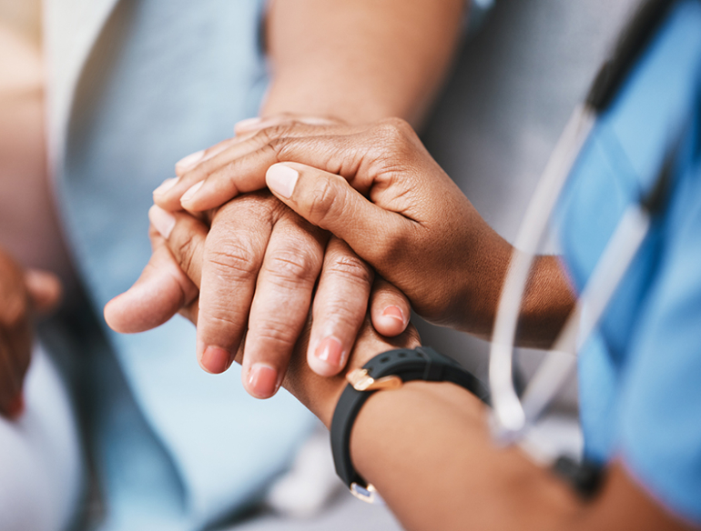 Empathy, trust and nurse holding hands with patient for help, consulting support and healthcare advice. Kindness, counseling and medical therapy in nursing home for hope, consultation and psychology
