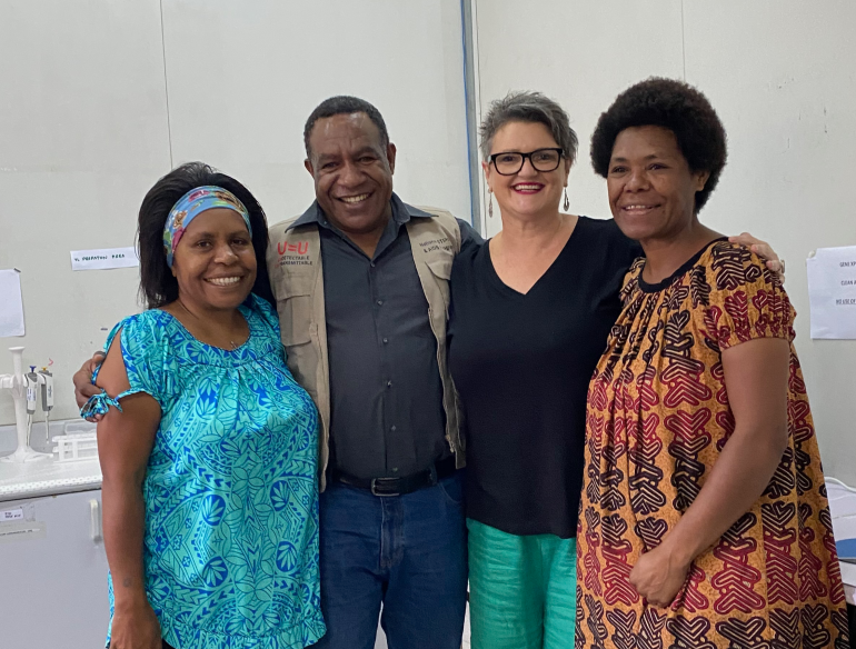 Angela Kelly-Hanku and ACT-UP PNG colleagues in the laboratory 