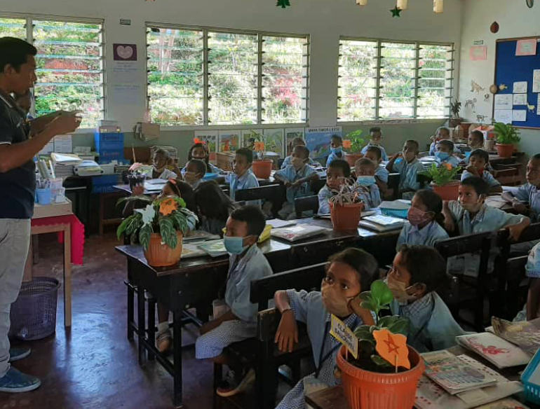Children in classroom in Timor-Leste, as part of a mass drug administration program to control scabies, impetigo, and intestinal worm infections. Neglected tropical diseases.