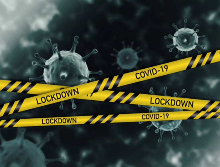 COVID-19 virus behind yellow, police style lockdown tape Credit: Jasmine Nongrum, iStock