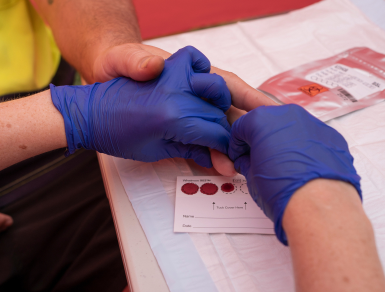 Participant getting a dried blood spot test for hepatitis C in Cairns for the ETHOS Study. Credit: Conor Ashleigh.