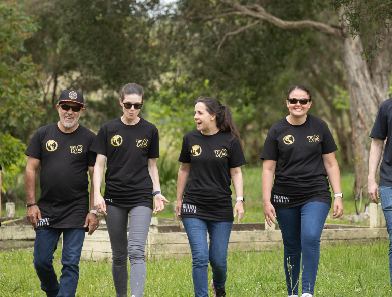Group of Kirby staff, researchers walking in a line, on site at Kempsey, NSW for Enhance Walkabout project to raise awareness and knowledge of sexual health. Credit: Thunderbox Films