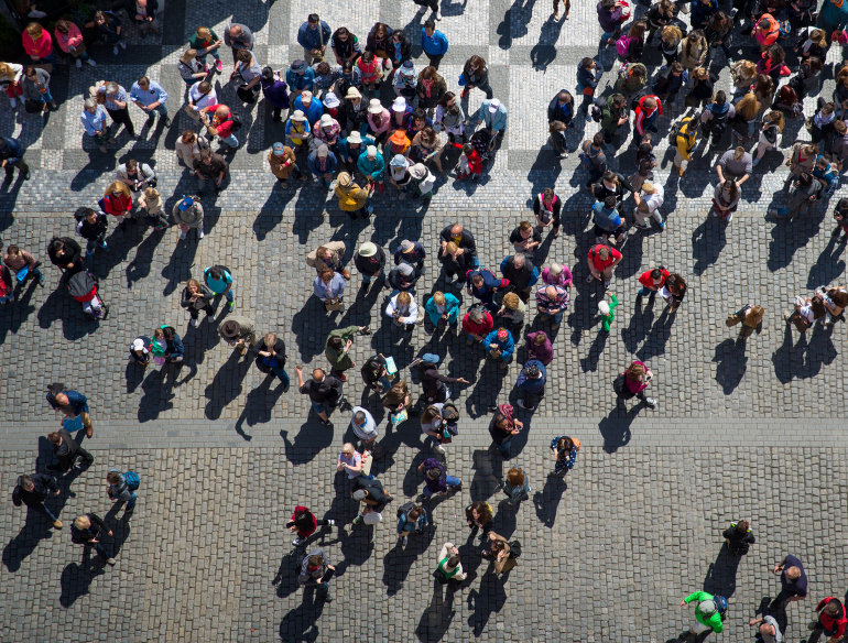 Overhead image of a crowd of people outdoors. Credit: Shutterstock.