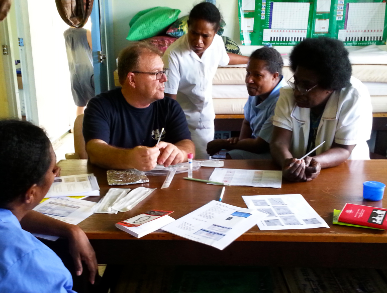 Dr Steve Badman training health staff in point-of-care testing, Papua New Guinea. Credit: Andrew Vallely/Kirby Institute.