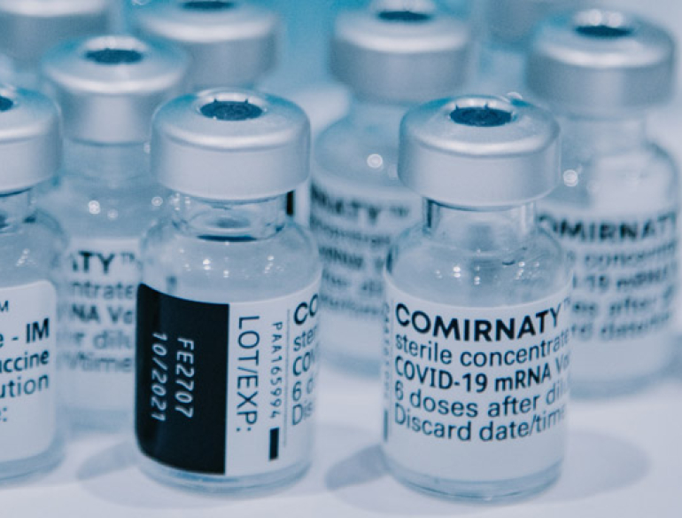 A group of bottles containing vaccine