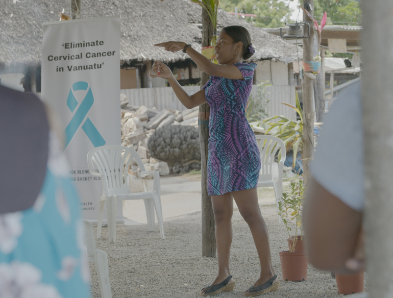 Vanuatu woman demonstrating cervical cancer pre screen outside teaching asia pacific community