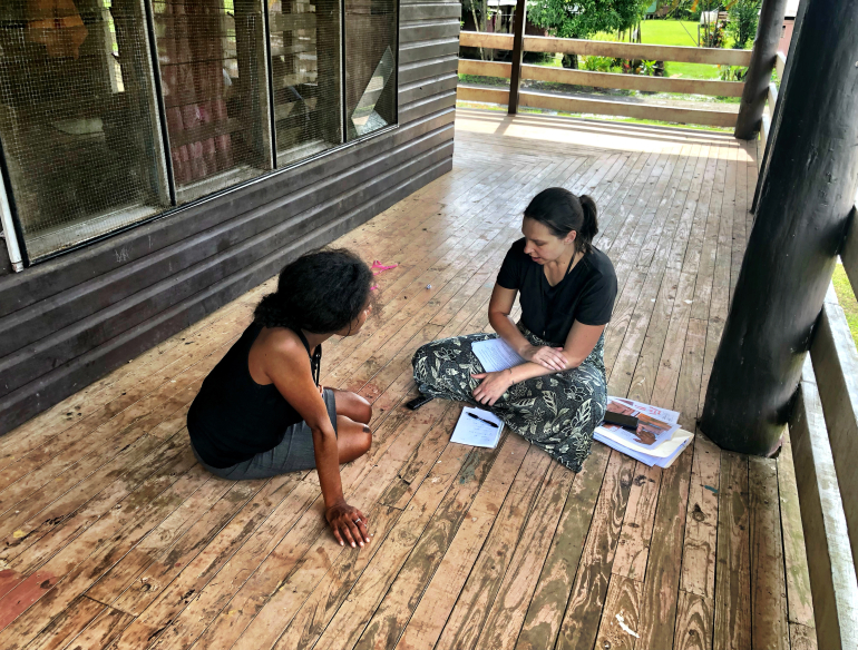 Kirby researcher talking to a community member in PNG about scabies and impetigo. Credit: Elke Mitchell/Kirby Institute.