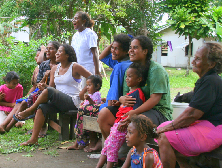 Group of smiling women and children from Solomon Islands. Credit: Flickr/Antony Robinson (CC BY-NC-SA 2.0)