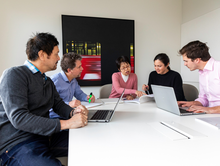 Diverse group of Kirby staff having a meeting. Credit: Bec Lewis/Kirby Institute.