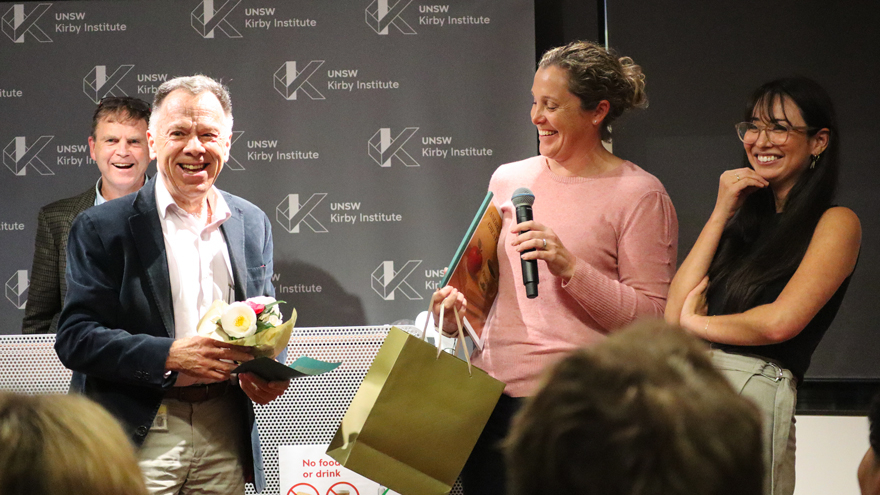 Emeritus Professor Andrew Lloyd AM receving gifts from Rowena Bull and Yumi Sheehan