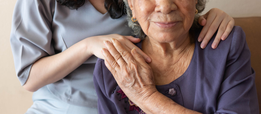 Young female nurse with older female patient grandma