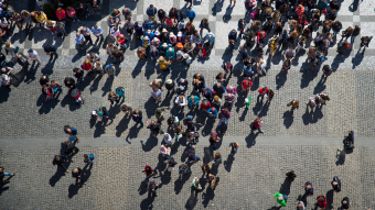 Overhead image of a crowd of people outdoors. Credit: Shutterstock.