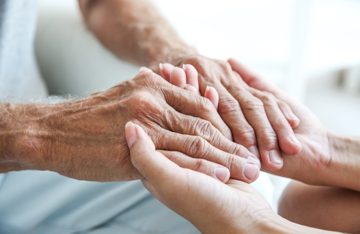 Two people holding hands