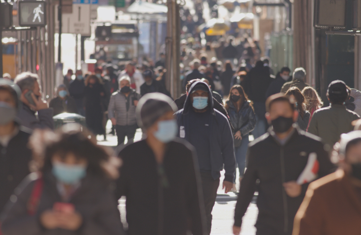 Crowd of walking masked people urban setting 