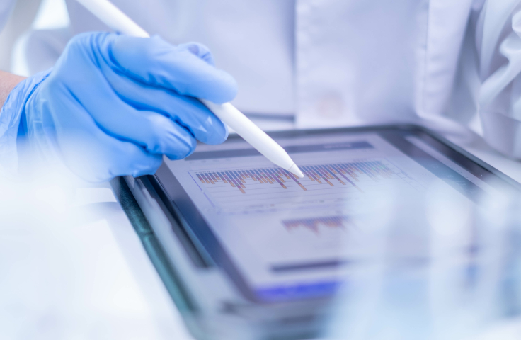 Scientist recording data on tablet device