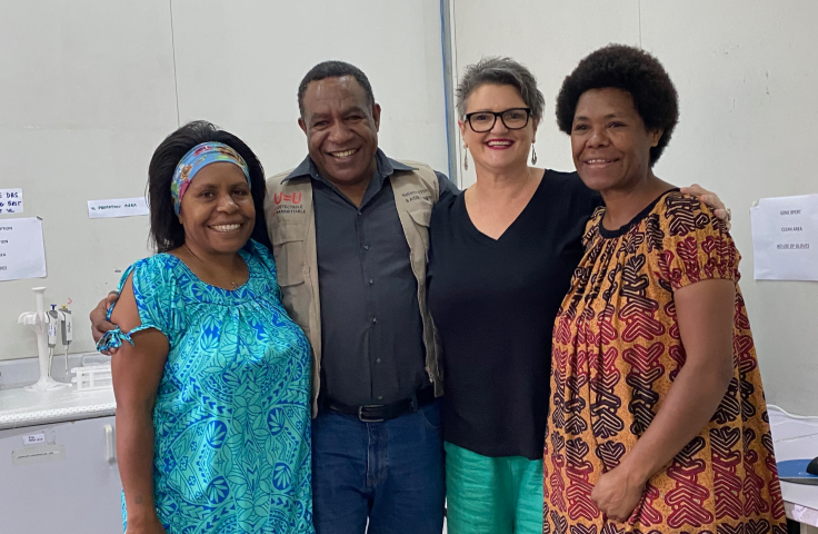 Angela Kelly-Hanku and ACT-UP PNG colleagues in the laboratory 