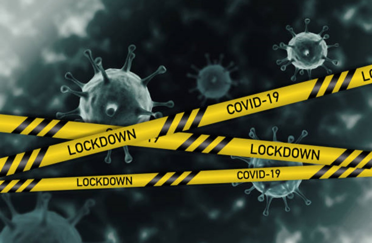 COVID-19 virus behind yellow, police style lockdown tape Credit: Jasmine Nongrum, iStock