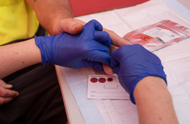 Participant getting a dried blood spot test for hepatitis C in Cairns for the ETHOS Study. Credit: Conor Ashleigh.