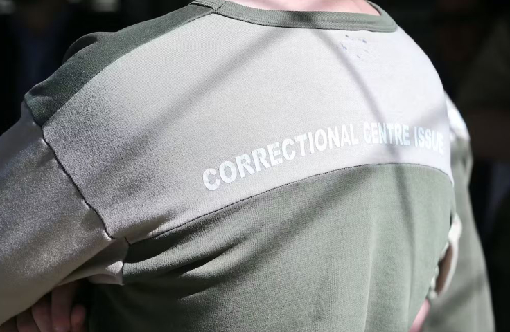 Backview of green prison jumper