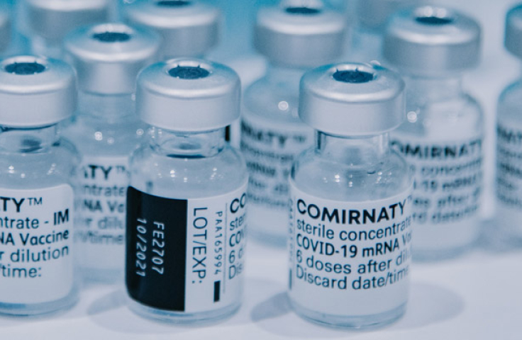 A group of bottles containing vaccine