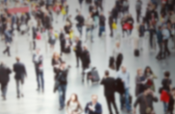 Blurry image of a large crowd of people. Credit: Shutterstock