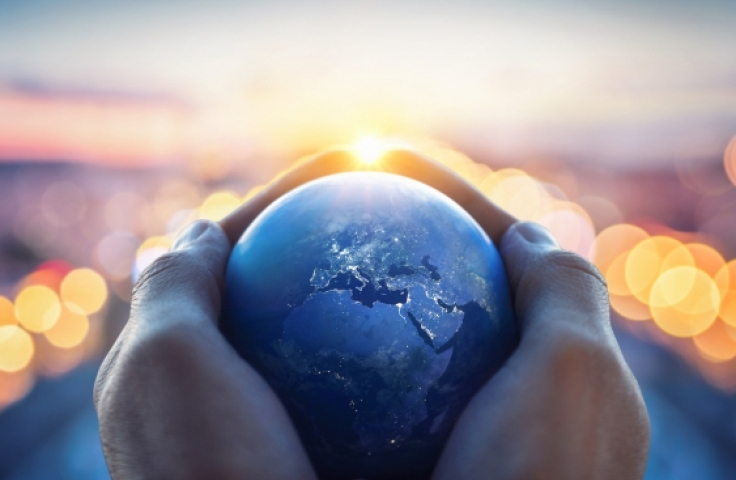 Small globe held in two hands. Credit: Shutterstock