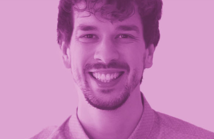 Smiling man in collared shirt with purple filter